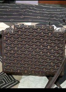 Brown Quilted Handbag with Sequins and Pom-Pom Cha