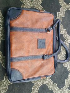 Brown and Navy Leather Travel Bag
