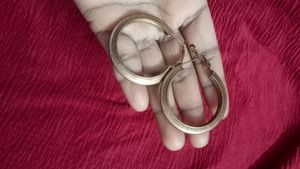 Gold decorative hoop Earrings.