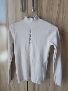 Cute Beige High Necl Top With Ruffle Nect Detail