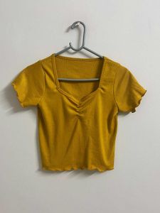 Title:Mustard Yellow Ribbed Lettuce Hem Crop Top