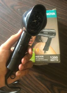 Nova hair dryer , with one year warranty , new pack piece and never used