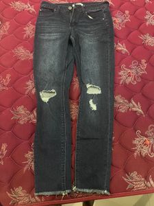 Ripped Dark Blue Jeans