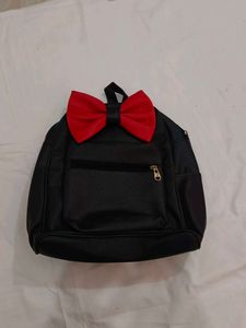 Black Backpack with Red Bow