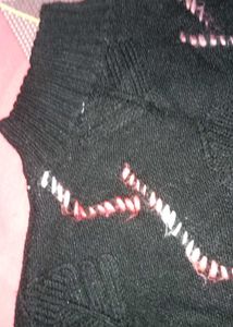 Cozy Black Knit Sweater with Wavy Trim