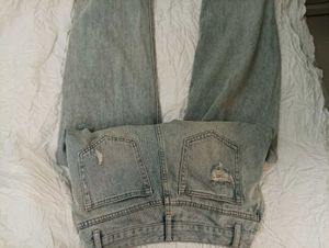 damaged jeans .