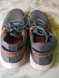 Gray and orange sneakers Ladies