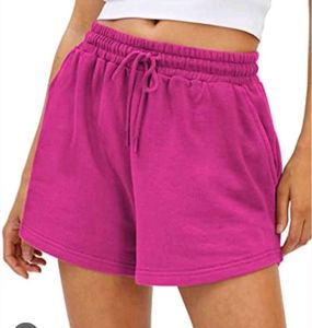 A pair of fuchsia shorts with  drawstring waist
