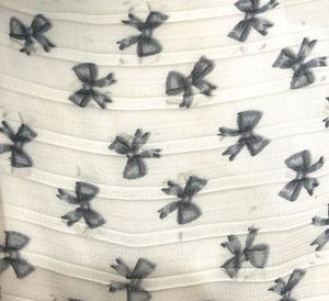 Pleated Bow Print Mini Skirt
