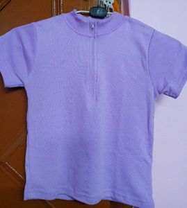 A light purple, body-fitting crop top