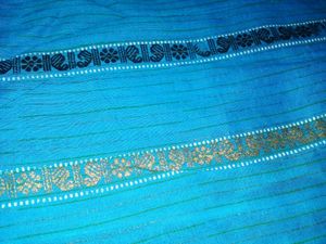 Womens Blue Cotton Saree With Golden Bady.