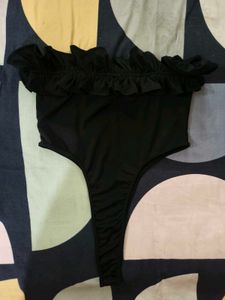 Black Ruffle Tube Bodysuit From NEWME