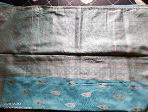 Elegant Aqua Saree with Intricate Paisley Detail