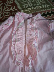 pink ruffle shirt