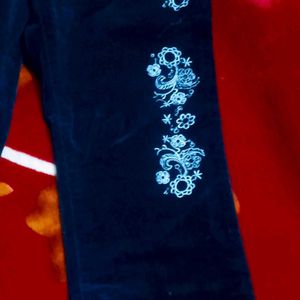 Black Coloured Bootcut Jean With Embroidery On It.