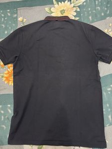 Stylish Black Polo with Unique Detail