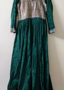 It's a Green Pleated Gown (Stiched) With Heavy (Bi