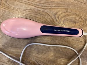 Woman’s hair straightener