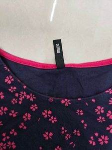 A Navy Blue Shirt With Pink Printed Flowers