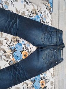 Distressed Blue Denim Jeans