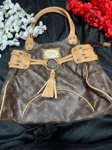 Louis Vuitton Logo Handbag with tassel