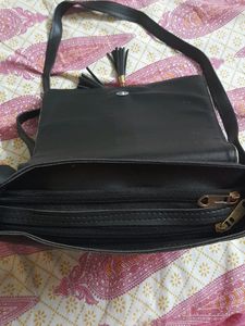 Pretty Fashionable Black Sling Bag . Can Easily Contain Mobile Phone, Small Water Bottle And Makeup Etc