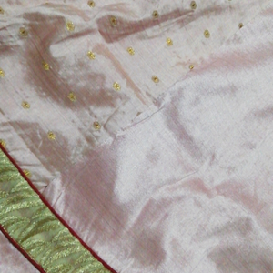 It is a patiyala dress along with duppata. one time used. no damage to patiyala Pant or duppata and the top had little that the red colour buttons has a  stitching  damage.