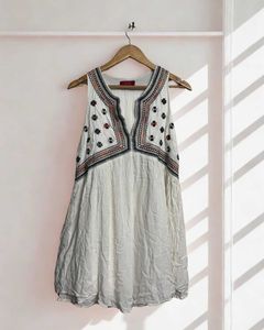 White Boho A Line dress with colourful embroidery.