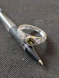 Pure silver ring with green zircon stone.