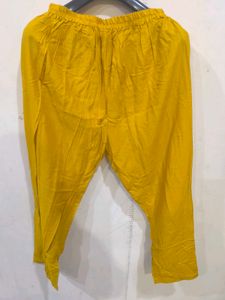 Mustard yellow churidar pant.