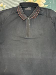 Stylish Black Polo with Unique Detail