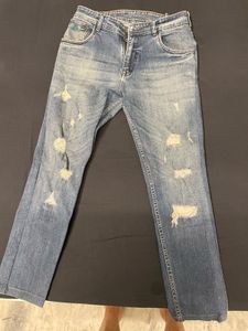 jeans in the photo have a distressed, ripped s