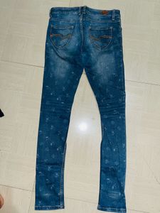 Edgy Elegance Distressed Floral Skinny Jeans”