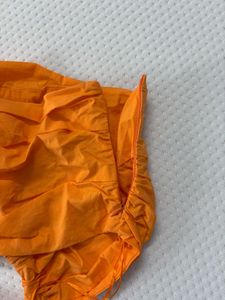 orange one shoulder top