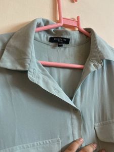 Light Blue Sleeveless Button-Down