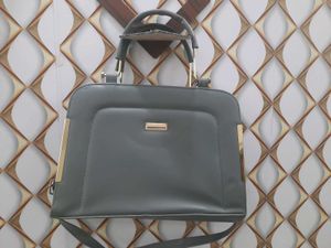 Grey Handbag with Gold Accents