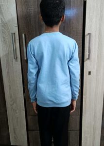 A Sky Blue Sweatershirt .