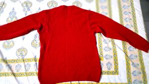 Branded red color sweater for men.