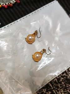 Gold pearl drop earring