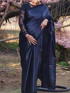 black saree with stiched blouse.