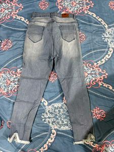 Distressed Fringe Hem Jeans
