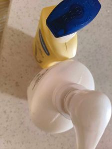 Empty Dove Shampoo And Vaseline Cream Bottle