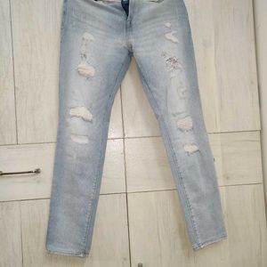 Light Blue Distressed Slim Fit Jeans.