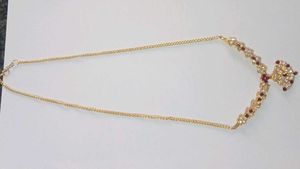 Elegant Gold Necklace With Maroon Stone