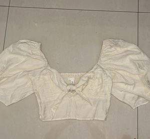 White puff sleeve tie-front top