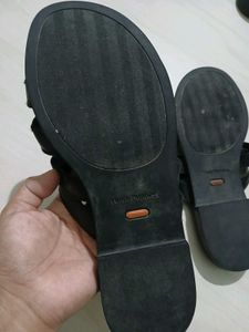 Black leather slides