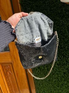Black metal mesh sling bag
