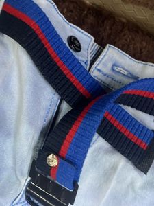 Light Wash Jeans with Striped Belt