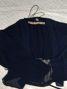 Elegant Blue Top with Embellished Neckline