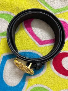 Black belt with golden buckle